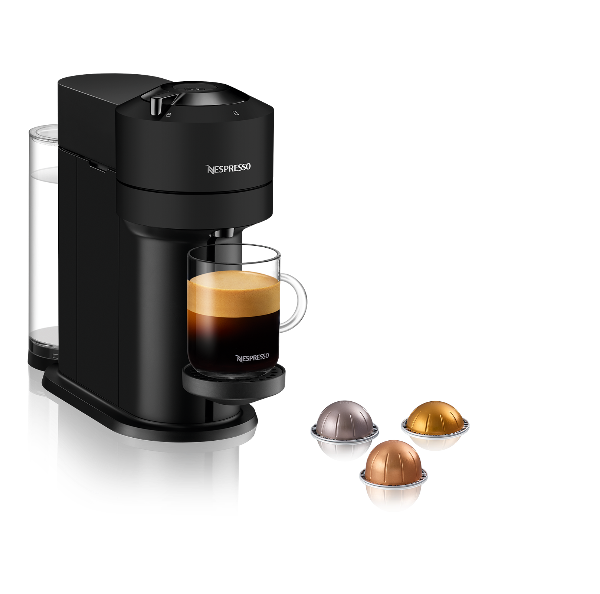 Nespresso coffee machine with a glass of coffee and capsules on a white background