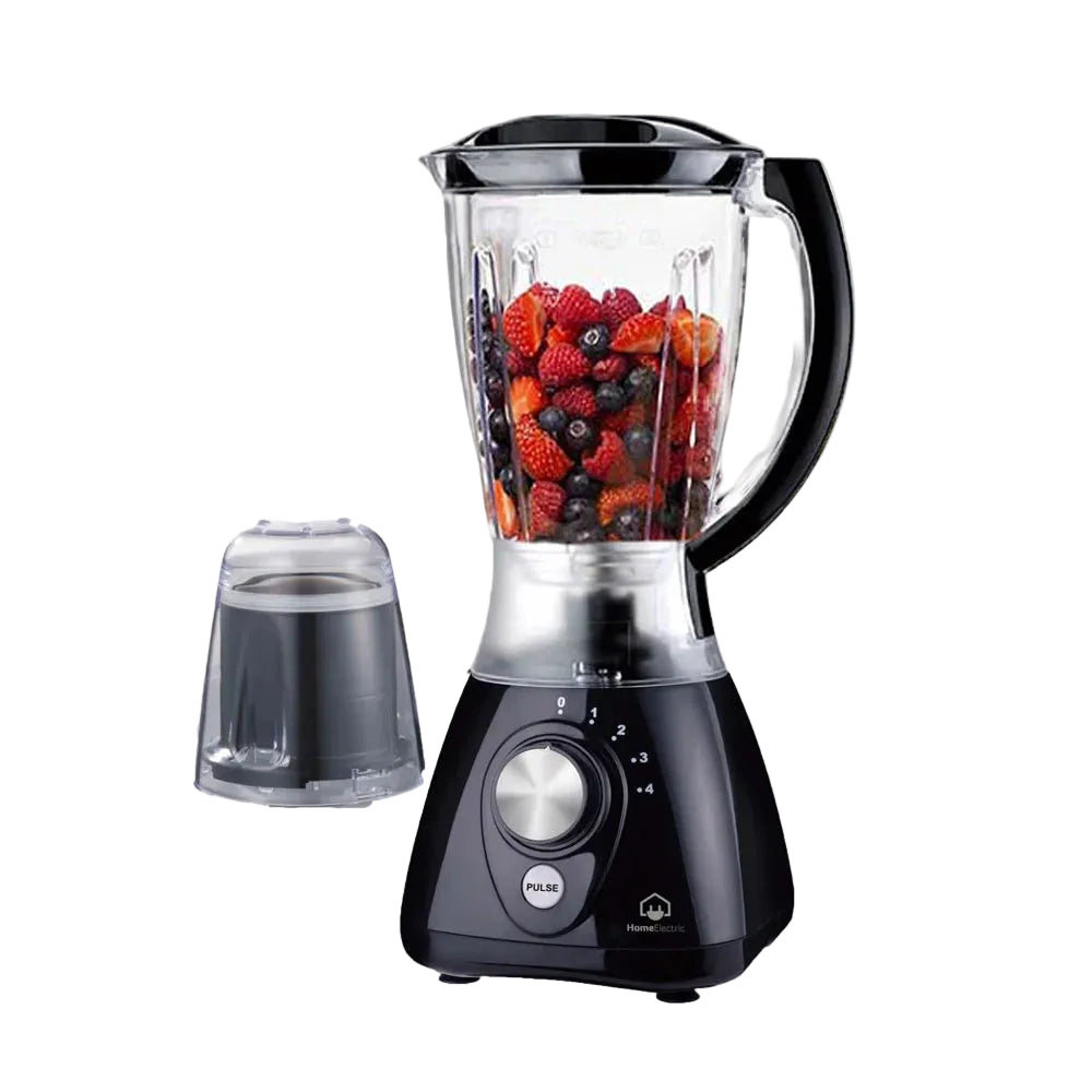 A black countertop blender with a clear pitcher filled with mixed berries, shown on a white background with the detached clear lid placed to the left.