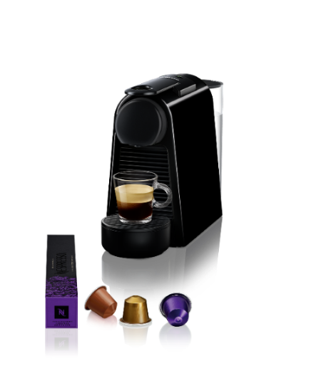 Black coffee machine with a cup of coffee and capsules on a white background