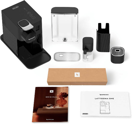 Nespresso coffee machine and accessories on a white background