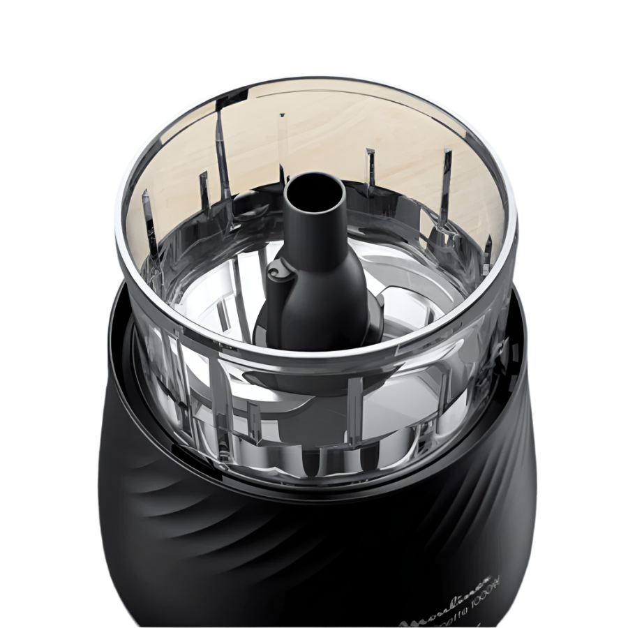 Black and silver kitchen grinder on a wooden surface