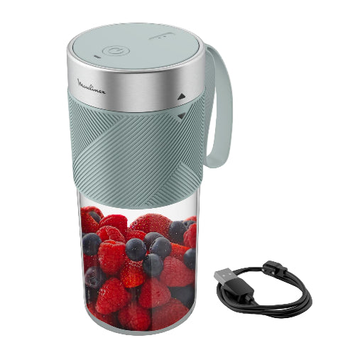 Portable blender with berries inside on a white background