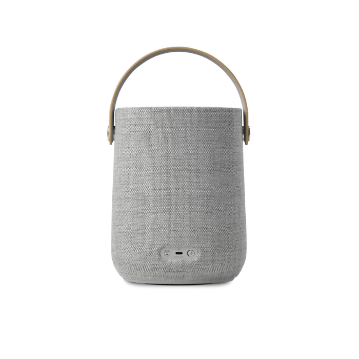 Gray textured speaker with a handle on a white background