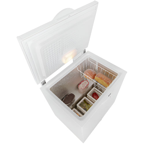 White chest freezer with food items inside on a white background