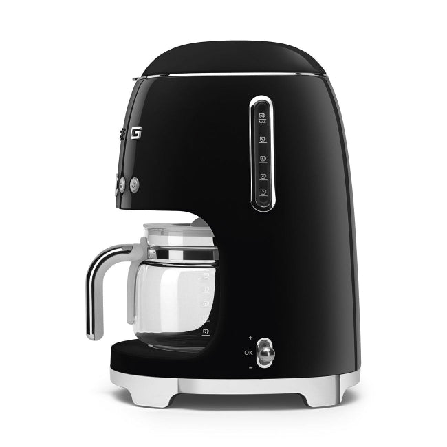 Black coffee machine with glass carafe on a white background