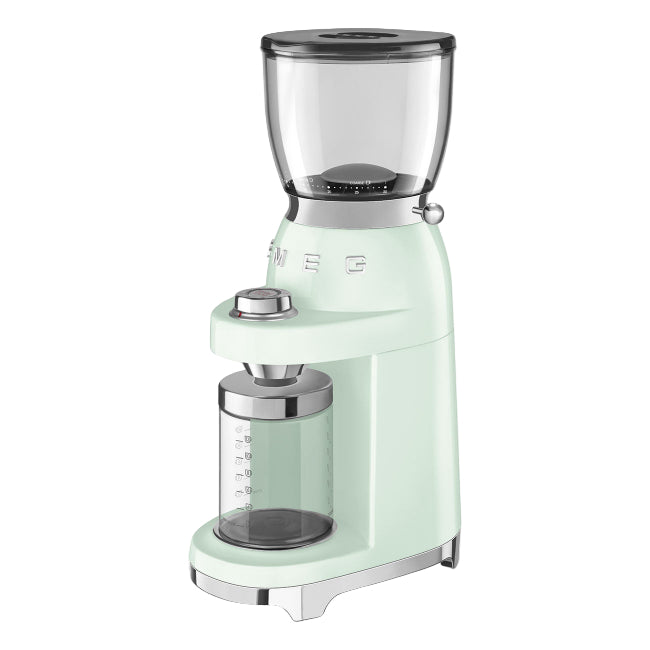 Mint green coffee grinder on a white background