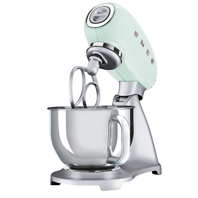 Vintage-style stand mixer with a light green head on a white background