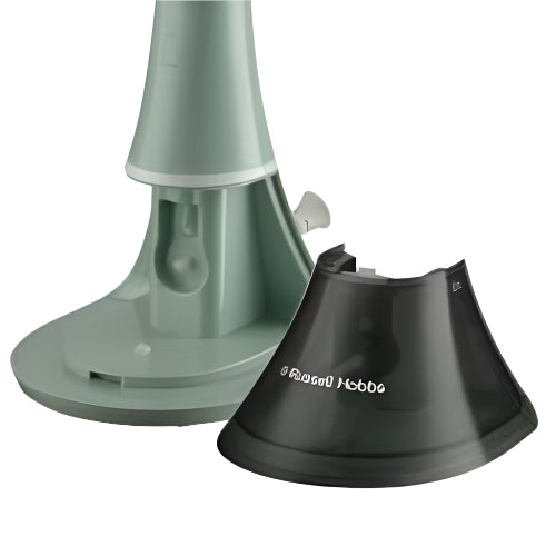 Two bird feeders, one green and one black, on a white background