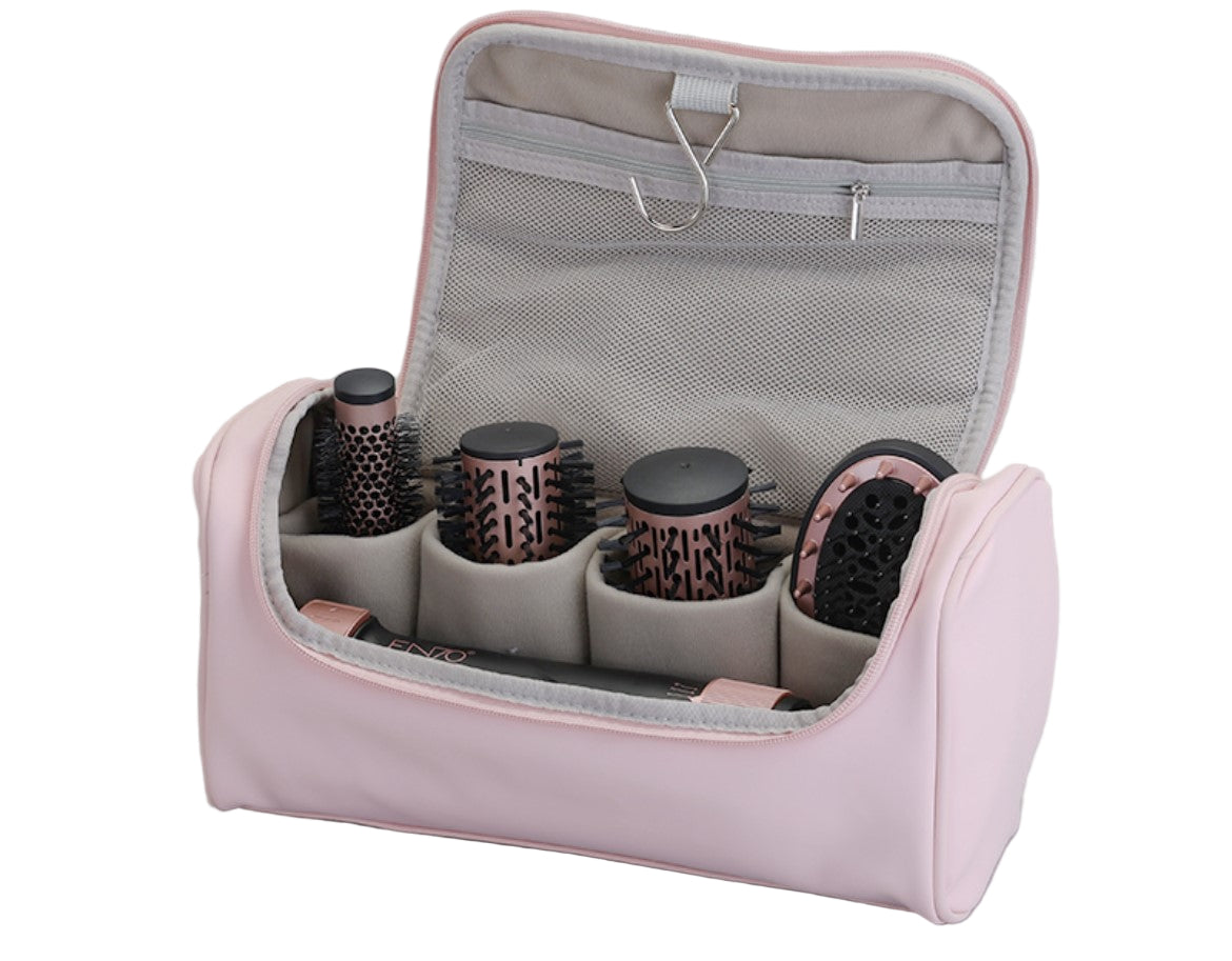 Pink hair styling tool case with brushes and attachments on a gray background