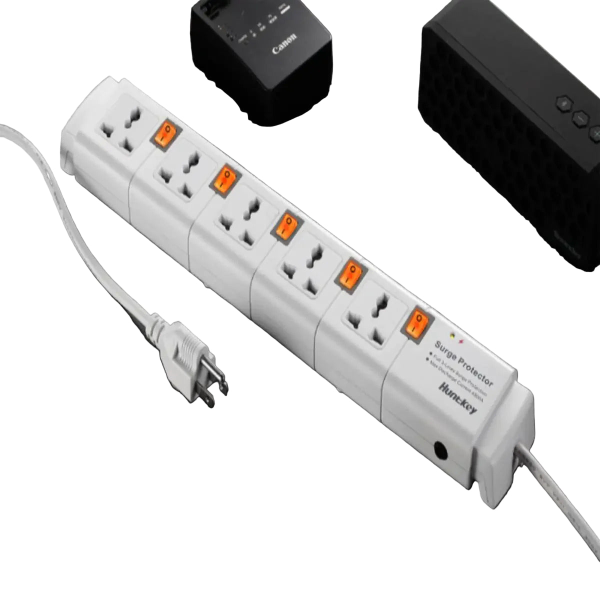 Power strip with multiple outlets on a dark wooden surface