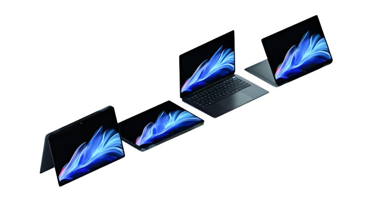 Four laptops with colorful screens on a light gray background