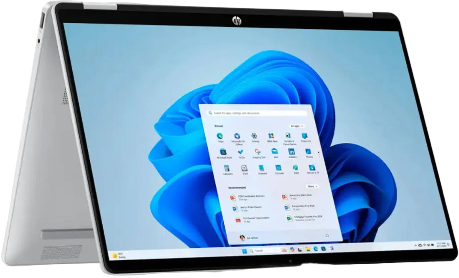 HP laptop with a blue flower and app icons on the screen