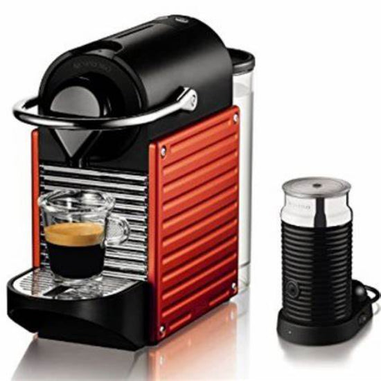 Red and black Nespresso coffee machine with a glass container and milk frother on a white background