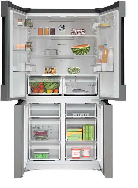 Open refrigerator with various food items inside on a white background