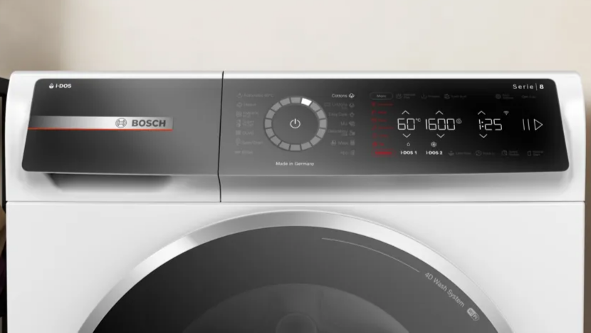 Bosch washing machine with digital display on a light background