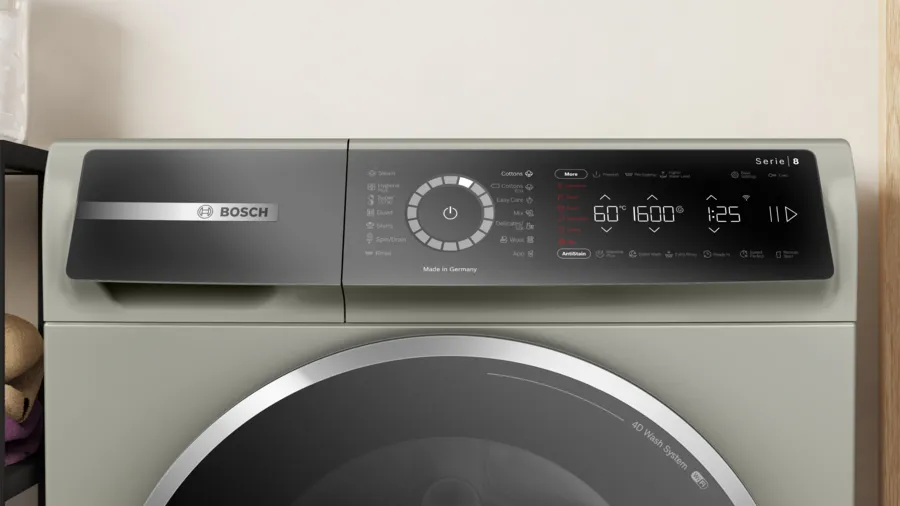 Bosch washing machine with digital display on a light background