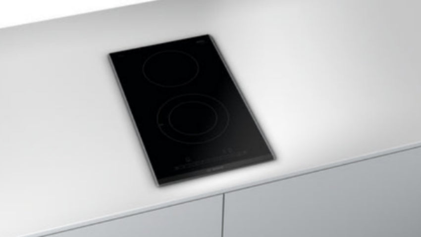 Induction cooktop on a white countertop
