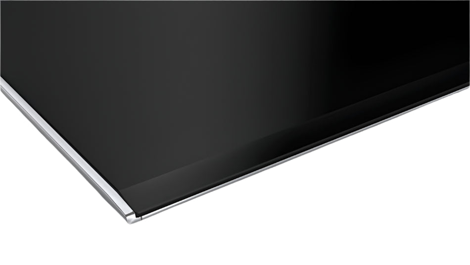 Close-up of a black electronic device on a white surface
