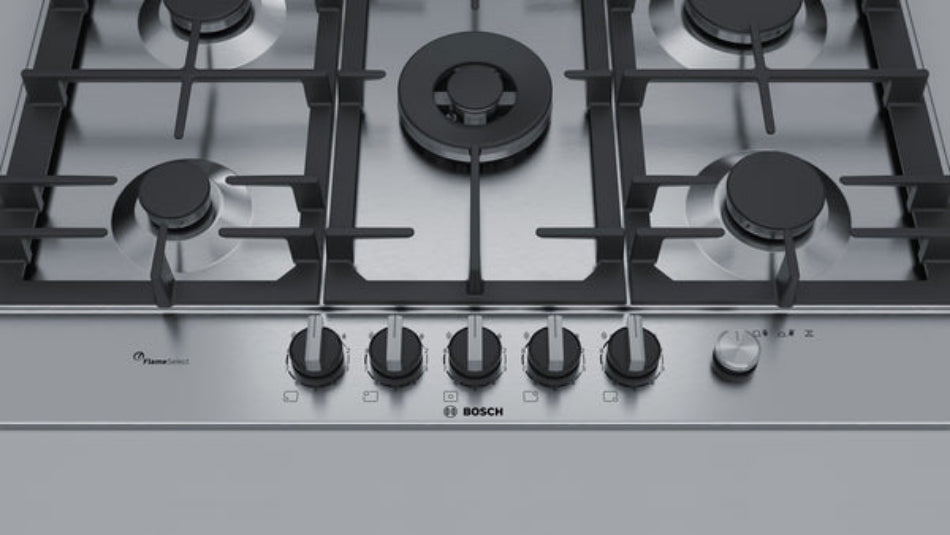 Bosch gas stove with black grates and control knobs on a white background