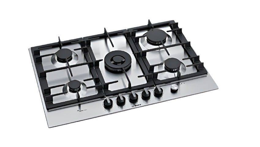 Gas stove on a kitchen counter with wooden cabinets and decorative items.