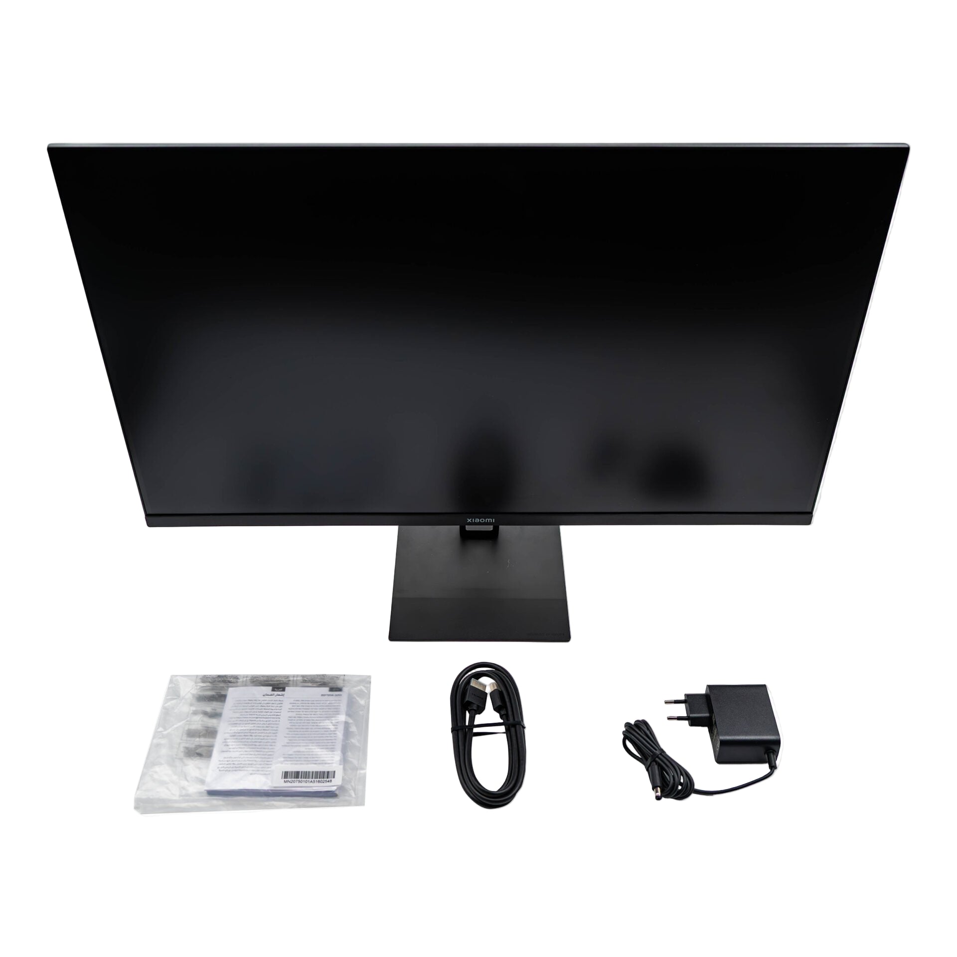 Black computer monitor with accessories on a white background