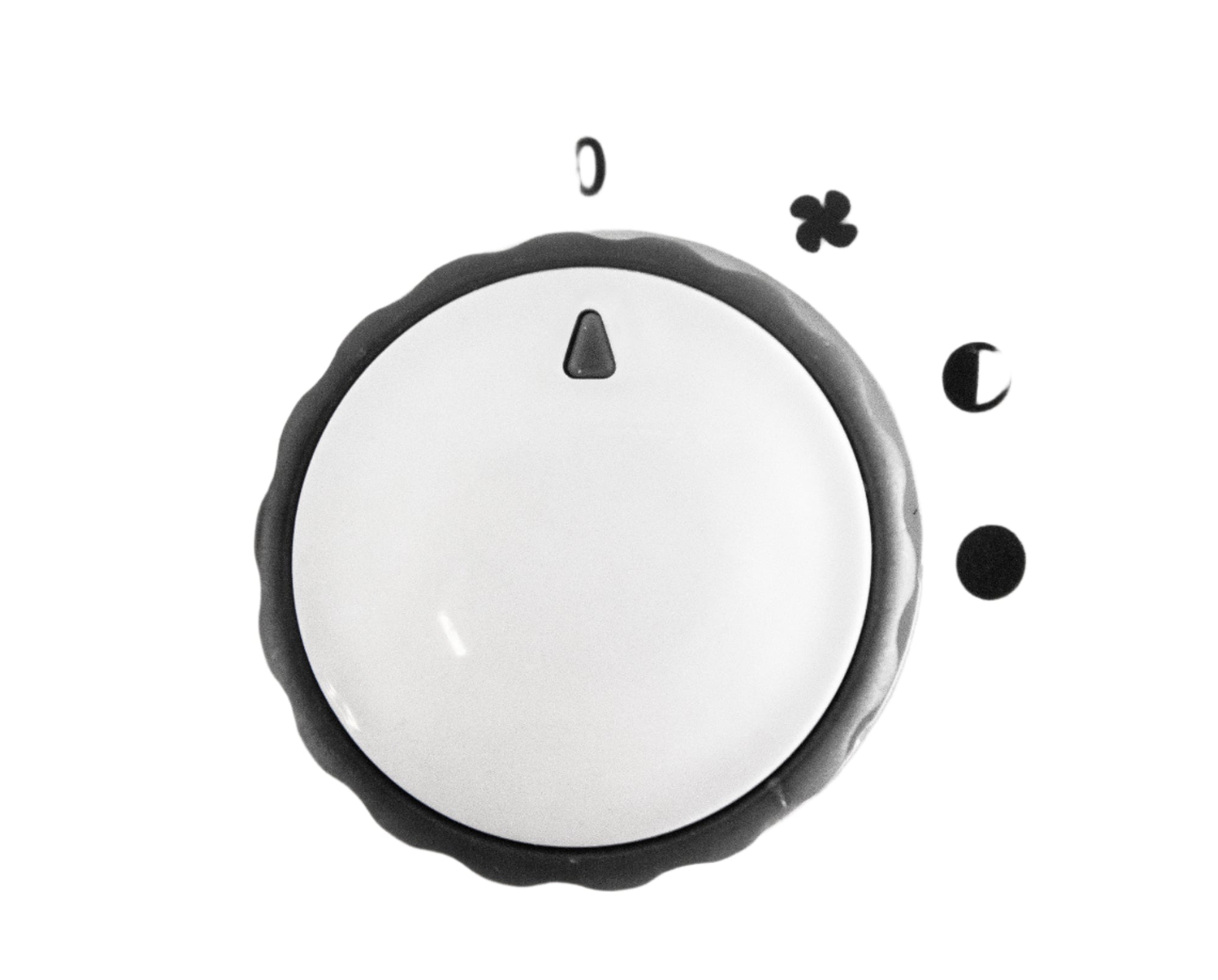 Close-up of a white knob with black markings on a light gray background