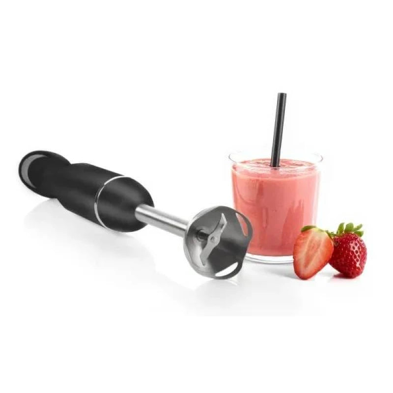 Black immersion blender next to a glass of pink smoothie with strawberries on a white background