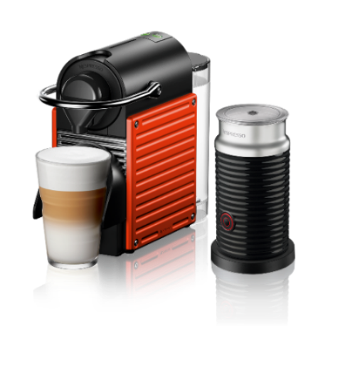 Nespresso coffee machine with a glass of coffee on a white background