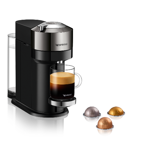 Nespresso coffee machine with a glass of coffee and capsules on a white background