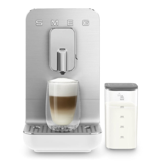 SMEG coffee machine with a glass of layered coffee and milk on a white background