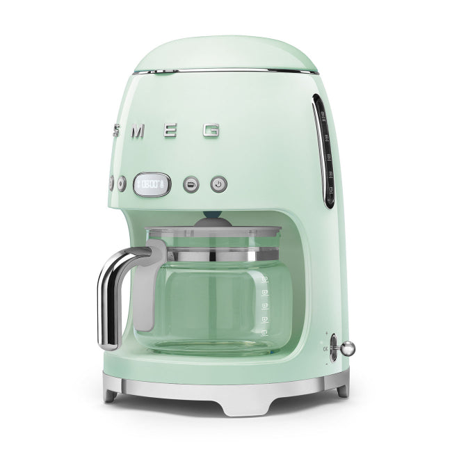 Mint green coffee machine with Smeg logo on a white background