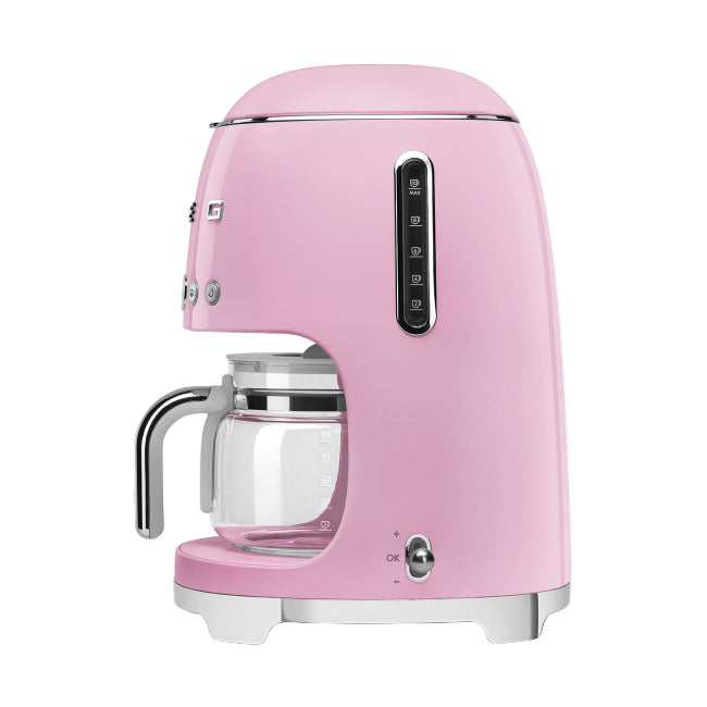 Pink coffee machine on a white background