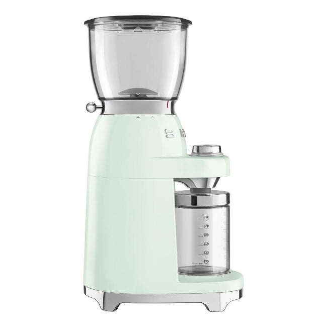 Mint green coffee grinder on a white background