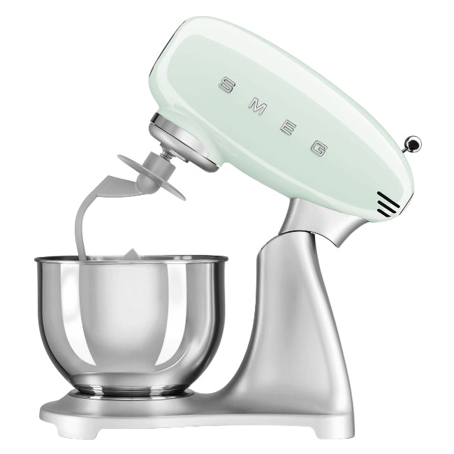 Mint green stand mixer with clear bowl on a white background