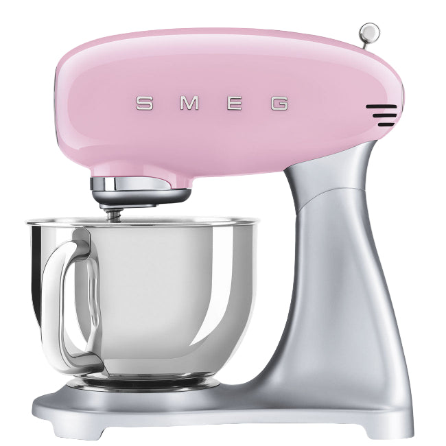 Pink Smeg stand mixer with a clear mixing bowl on a white background