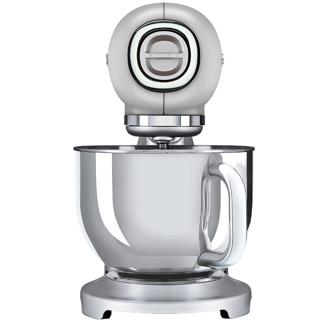 Silver stand mixer with clear mixing bowl on a white background