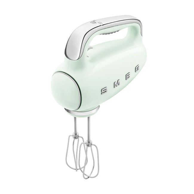 Mint green hand mixer with 'Smeg' branding on a white background