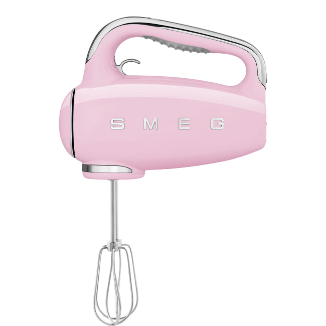 Pink hand mixer with SMEG logo on a white background