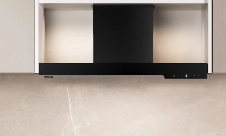 Black Teka range hood mounted above a kitchen countertop.