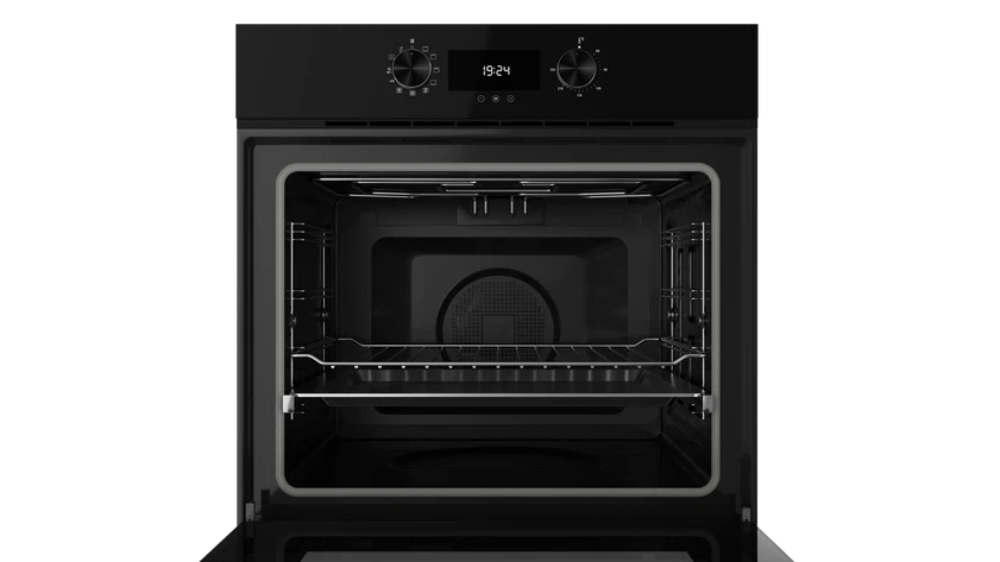Black oven with open door on a white background