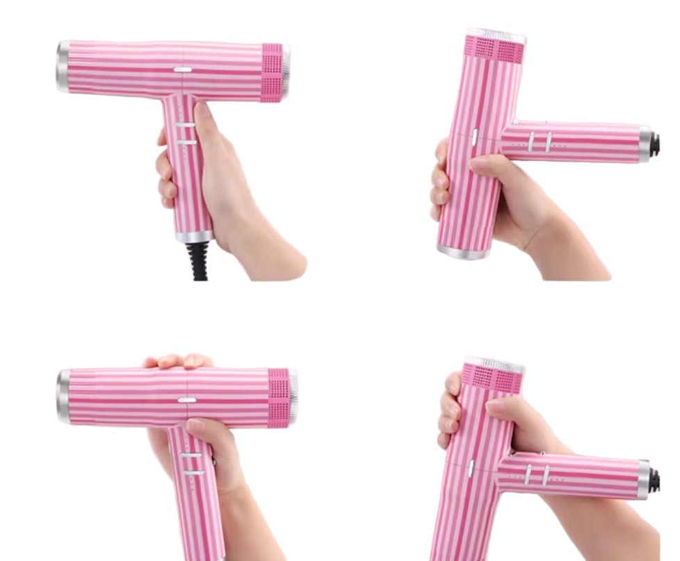 Pink handheld device with striped pattern held by a hand on a pink background
