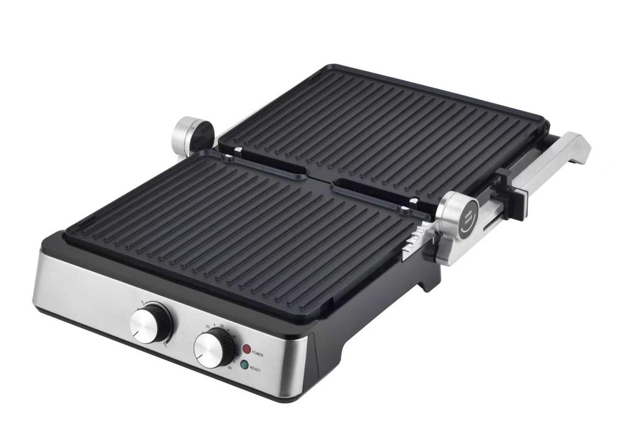 Double-sided grill with two heating plates on a white background