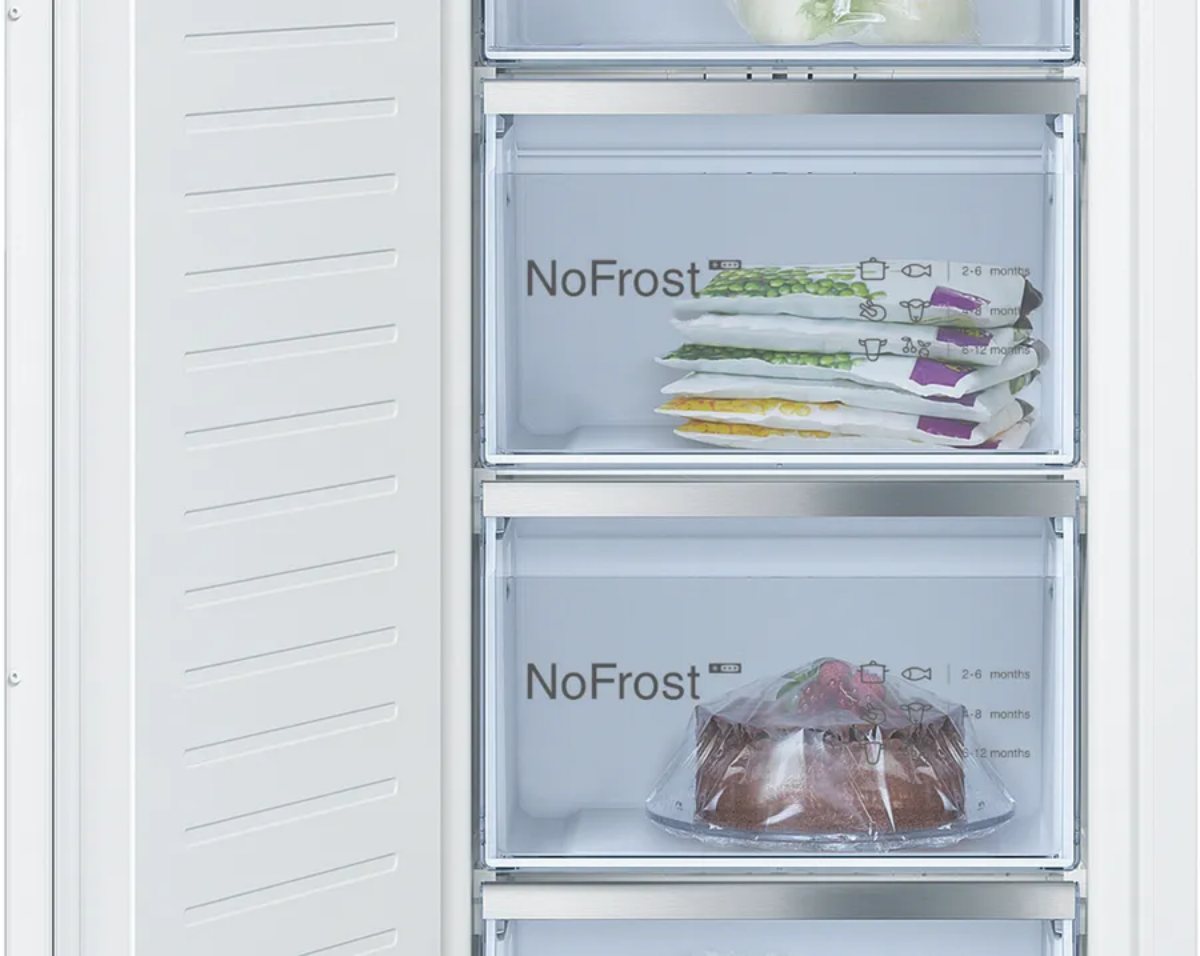 Open refrigerator with 'NoFrost' labeled compartments on a white background