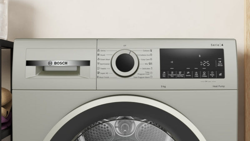 Bosch washing machine with control panel and brand logo.