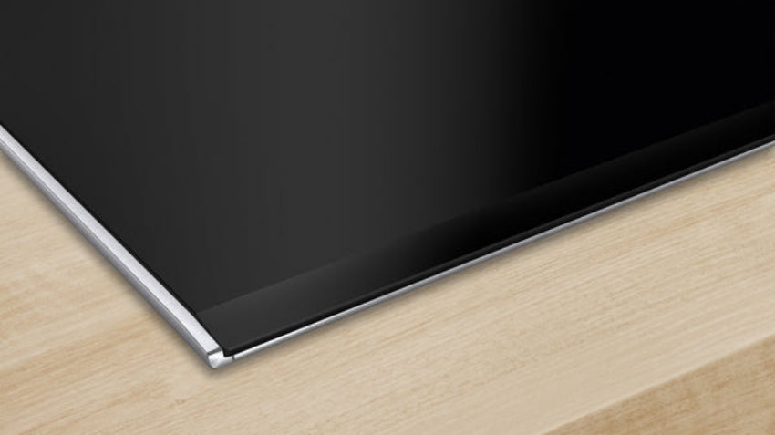 Black flat-screen TV on a wooden surface