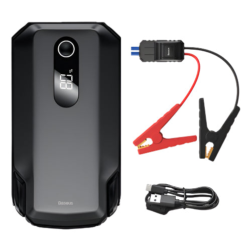 Black battery jump starter with cables and clamps on a white background
