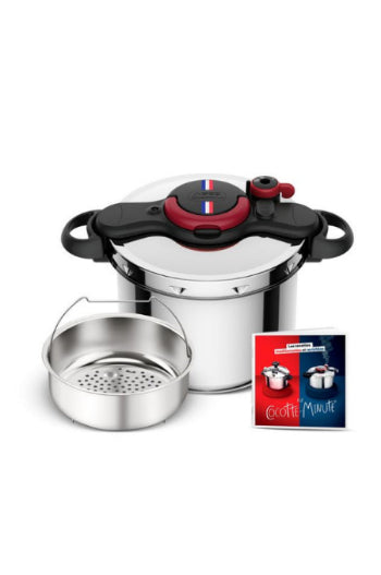 Pressure cooker with a small pot and recipe book on a white background